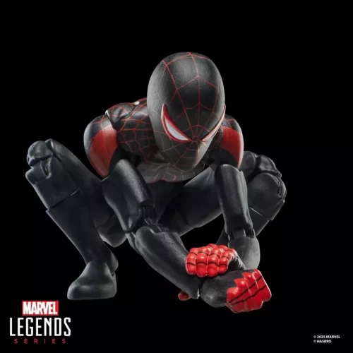 Hasbro Marvel Legends Series Miles Morales Ultimate Spider-Man crouching and grabbing wrist.