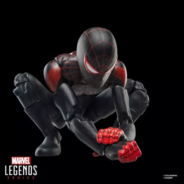 Hasbro Marvel Legends Series Miles Morales Ultimate Spider-Man crouching and grabbing wrist.