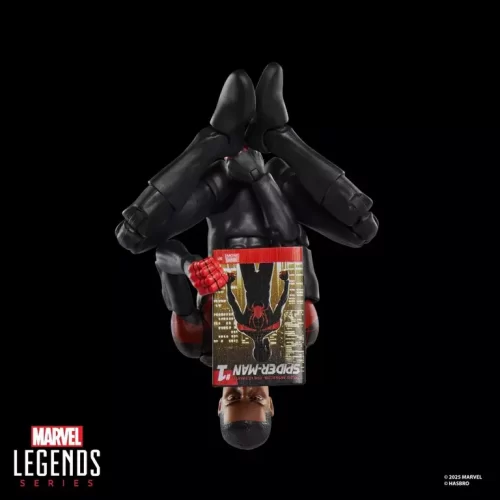 Hasbro Marvel Legends Series Miles Morales Ultimate Spider-Man reading Marvel's Miles Morales: Ultimate Spider-Man #1 comic upside down.