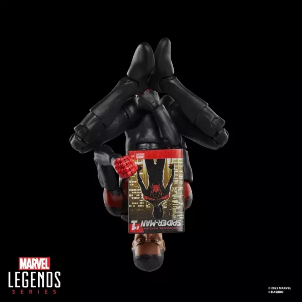 Hasbro Marvel Legends Series Miles Morales Ultimate Spider-Man reading Marvel's Miles Morales: Ultimate Spider-Man #1 comic upside down.